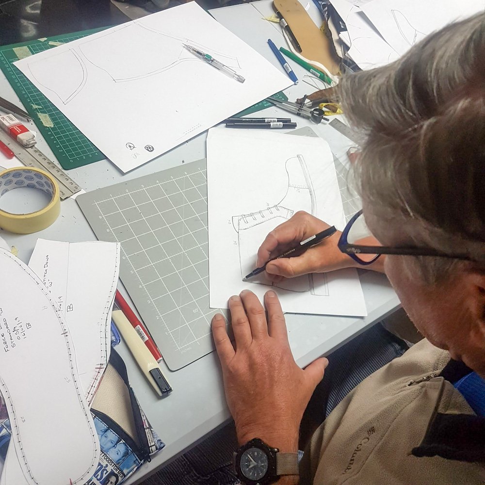 Styudent working on a ttechnical sketch of footwear